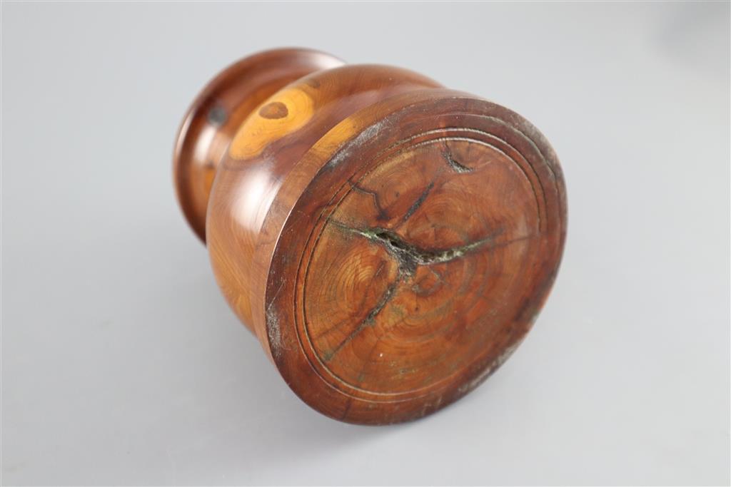 A late 18th / early 19th century turned yew wood pestle and mortar, pestle 9in. mortar height 5in.